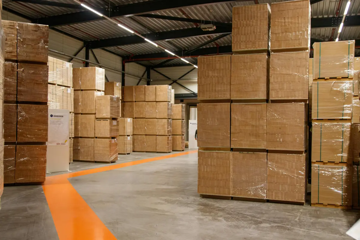Warehouse with stacked corrugated export cartons